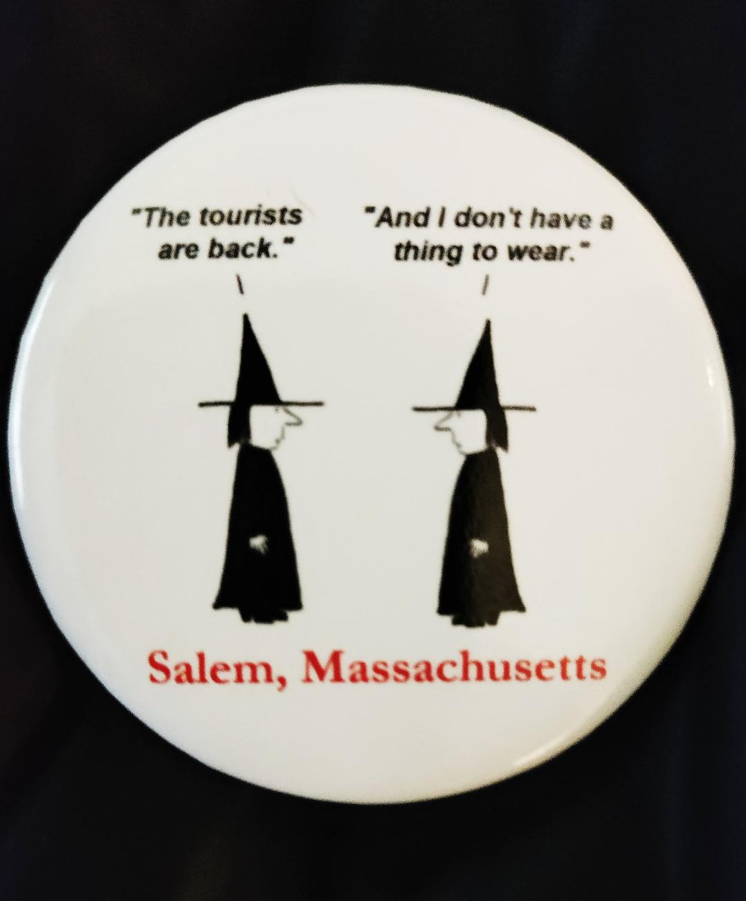"The tourists are back." "And I don't have a thing to wear." Pinback button.