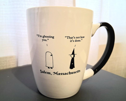 "I'm ghosting you." "That's not how it's done." White, ceramic, 12oz coffee mug with black handle and interior.