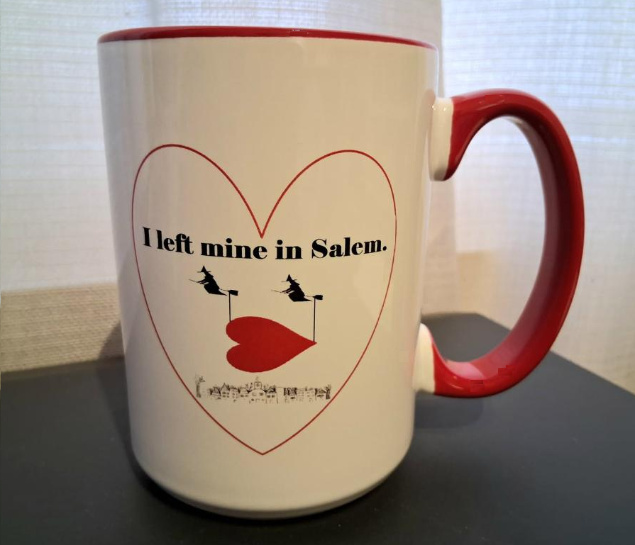 "I left mine in Salem" White, ceramic, 15oz coffee mug with red handle and interior.