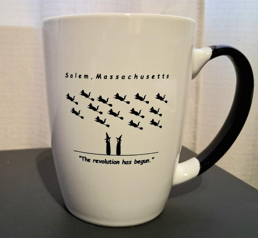 "The revolution has begun" White, ceramic, 12oz coffee mug with black handle and interior.
