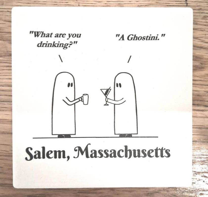 "What are you drinking?" "A Ghostini." White, ceramic coaster with cork bottom.
